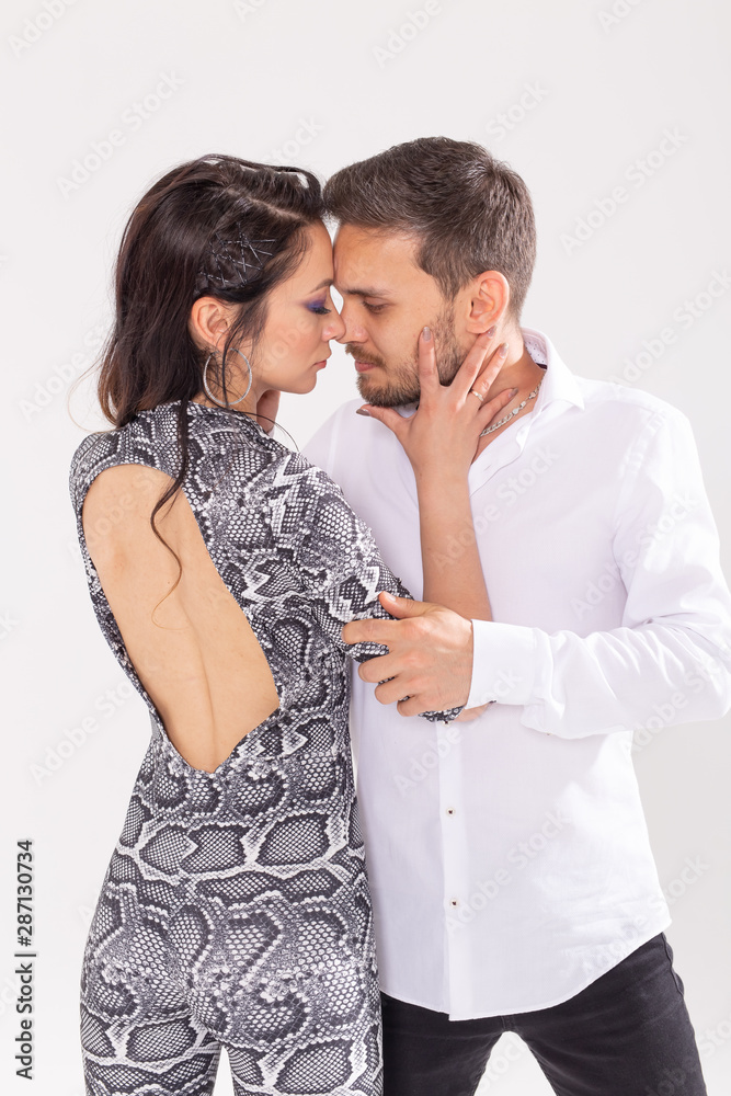 Young love couple dancing social danse kizomba or bachata over white background with copy space Young love couple dancing social danse kizomba or bachata over white background with copy space