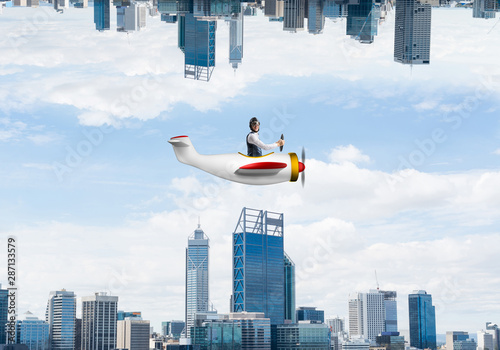 Businessman flying in small airplane