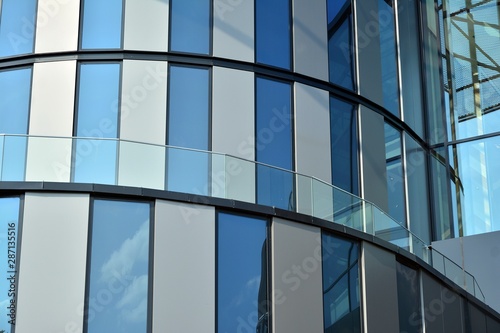 Facade fragment of a modern office building. Exterior of glass wall with abstract texture.