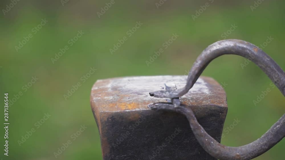 Smith forges nails in slow motion Smith forges nails in slow motion