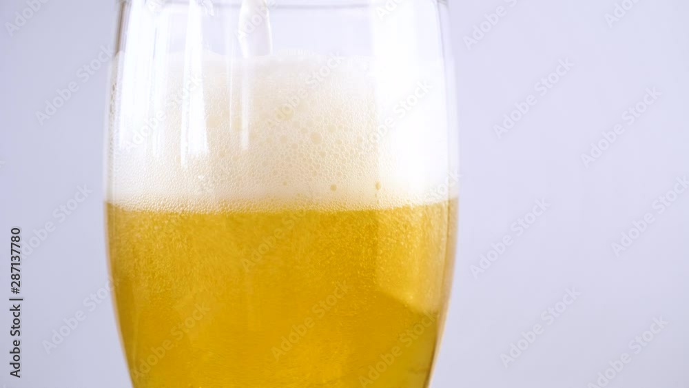 Pouring fresh could beer into glass. Close up 4k footage. Pouring fresh could beer into glass. Close up 4k footage.