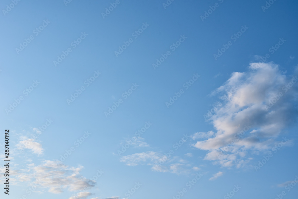 Blue sky with a white clouds, abstract background