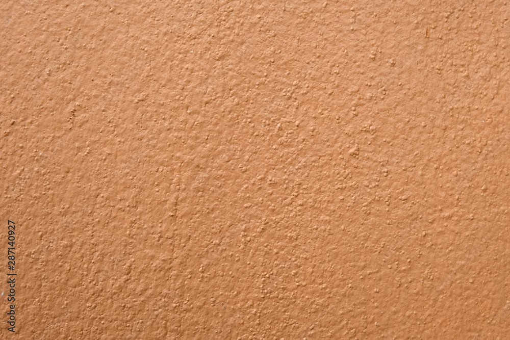 Brown cement wall background close up Brown cement wall background close up