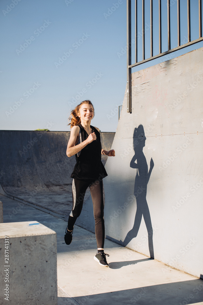 A girl jogging in the morning A girl jogging in the morning