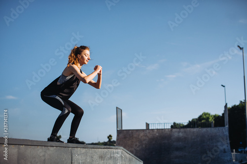 Sporty girl exercises in the morning © dsheremeta