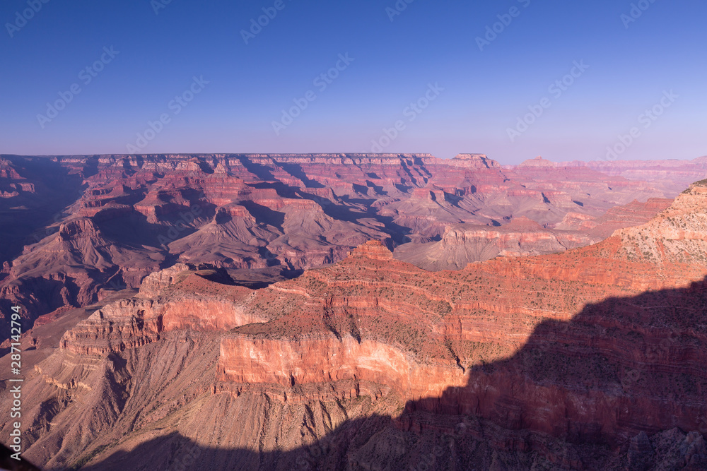 The Grand Canyon view unobstructed. No trees, looking down and across this geological wonder that took so many years to form is a popular national park in Arizona. Its natural beauty is unrivaled
