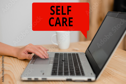 Text sign showing Self Care. Business photo showcasing the practice of taking action to improve one s is own health woman laptop computer smartphone mug office supplies technological devices