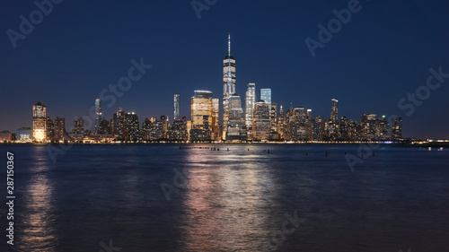 Manhattan skyline at night, color toning applied, New York City, USA. © MaciejBledowski