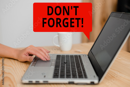 Text sign showing Don T Forget. Business photo showcasing used to remind someone about an important fact or detail woman laptop computer smartphone mug office supplies technological devices