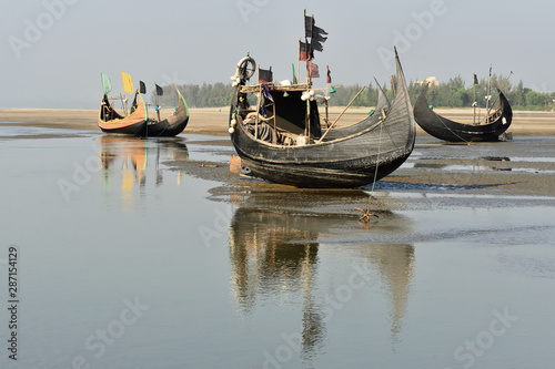 Canvastavla The traditional fishing boat (Sampan Boats) moored on the longest beach, Cox's Bazar in Bangladesh