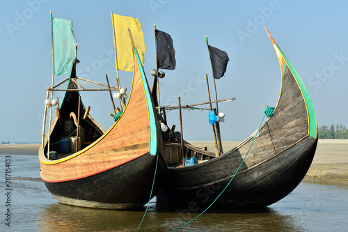 Tela The traditional fishing boat (Sampan Boats) moored on the longest beach, Cox's Bazar in Bangladesh
