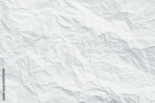 White crumpled paper. Crushed texture surface. Decorative layer. Abstract art background. Copy space.