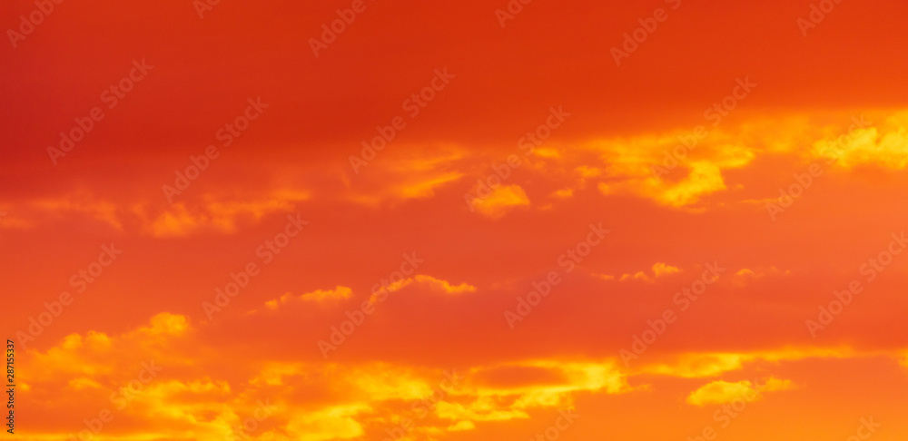 Beautiful clouds at sunset as a background Beautiful clouds at sunset as a background