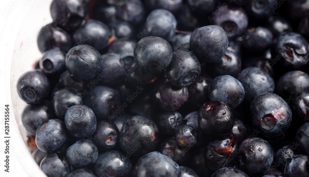 Blueberries in a glass on a white background Blueberries in a glass on a white background