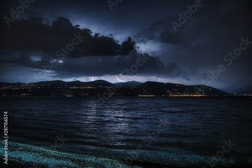 Thunderstorm over the mountains in the night, Major Lake, Italy