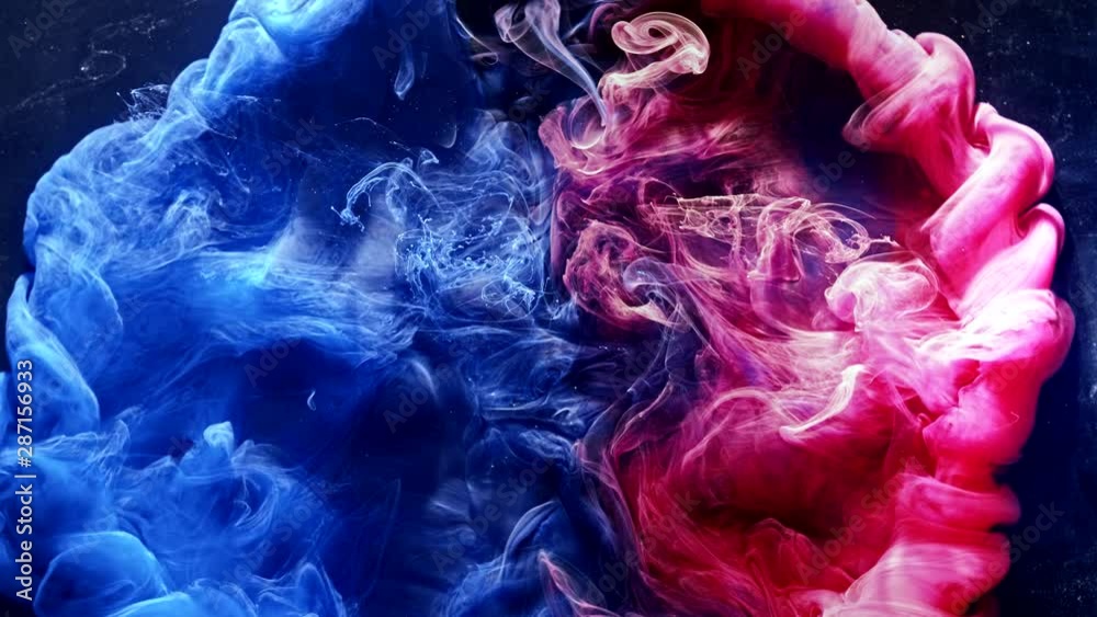 Ink water explosion. Harmony balance. Blue pink acrylic paint spill.