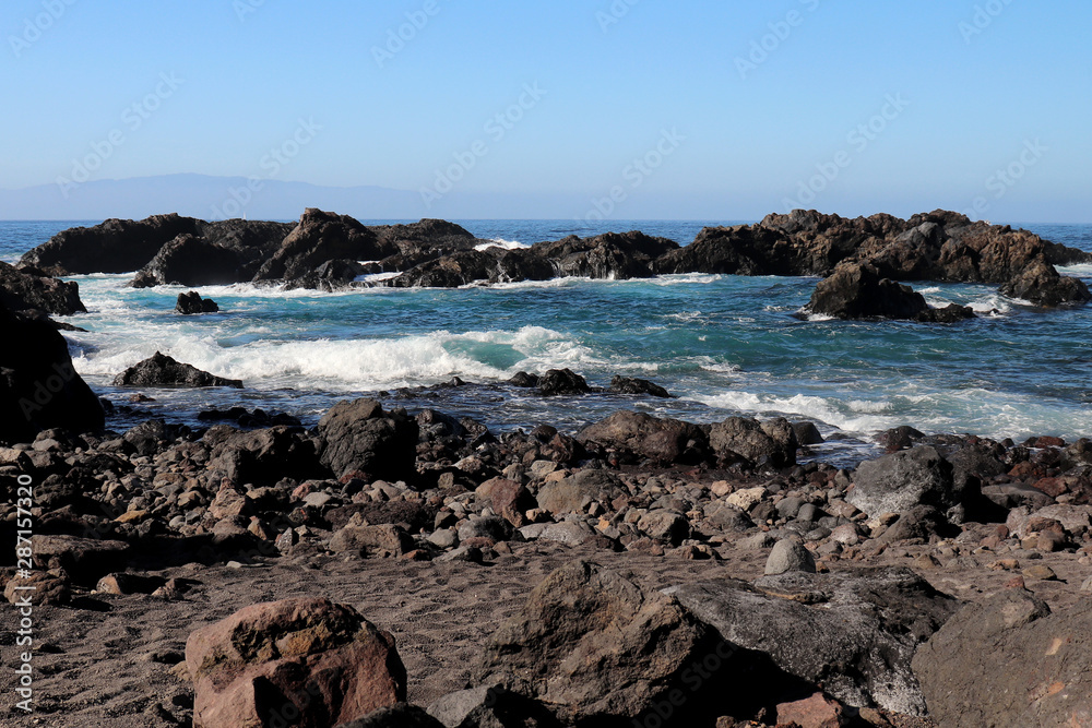 Rocky beach with waves in Tenerife, Spain