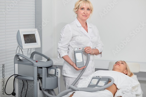 blonde doctor advertising the effective tool for weight loss. close up photo