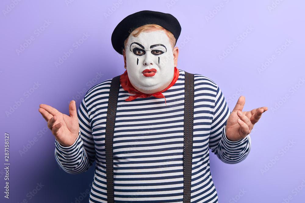unhappy serious plump man shrugging his shoulder in disbelief, posing to the camera. isolated blue background, studio shot. Really. are you kidding, man doesn't believe in information unhappy serious plump man shrugging his shoulder in disbelief, posing to the camera. isolated blue background, studio shot. Really. are you kidding, man doesn't believe in information