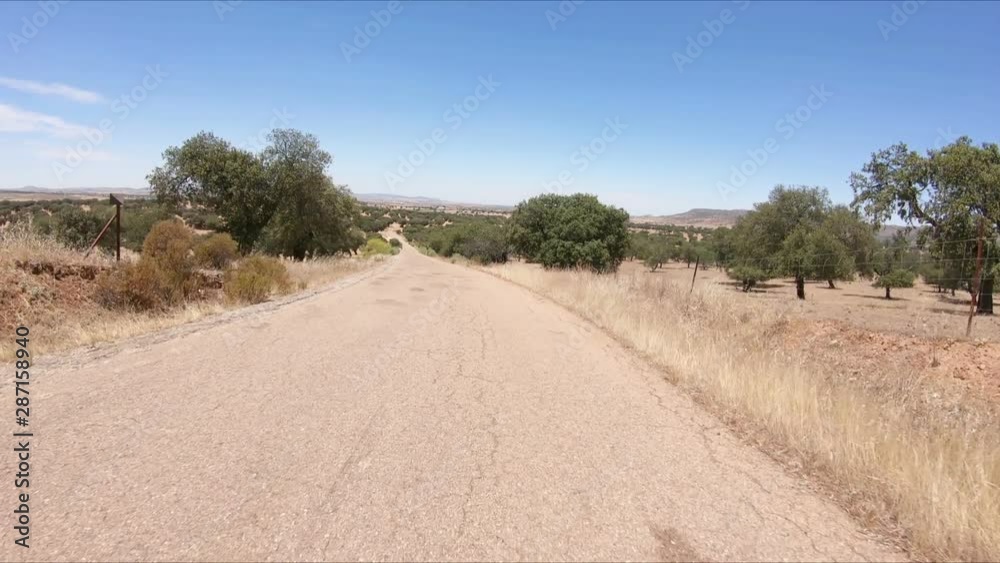 secondary paved road through fields of olive groves next to Monterrubio de la Serena, province of Badajoz, Extremadura, Spain secondary paved road through fields of olive groves next to Monterrubio de la Serena, province of Badajoz, Extremadura, Spain