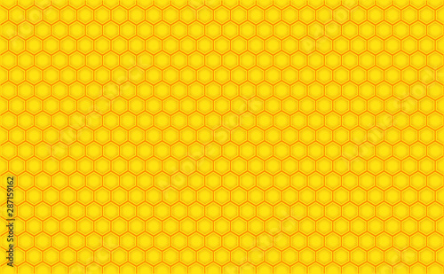 Abstract honeycomb repeated pattern in golden yellow. Geometric background or seamless pattern inspiration of hexagons, prismatic cells similar to beeswax frames or hive frames built by honey bees.