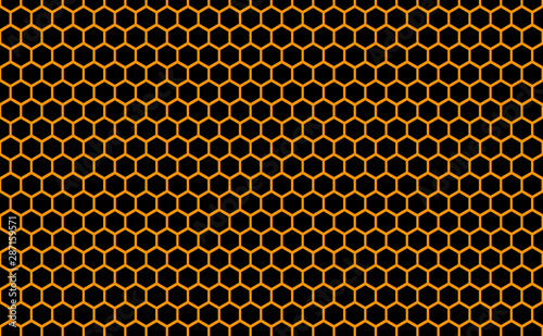 Abstract honeycomb repeated pattern in golden yellow against a back background. Geometric background or seamless pattern inspiration of hexagons, prismatic cells similar to beeswax or beehive frames.