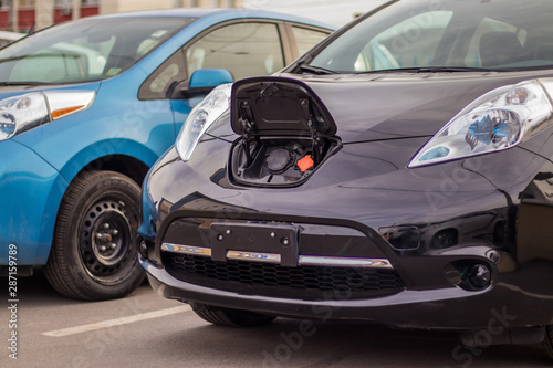 Electric vehicle waiting in line for charging © Павел Печёнкин