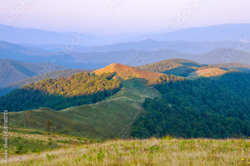 View of morning illuminated mountains. Summer mountain landscape