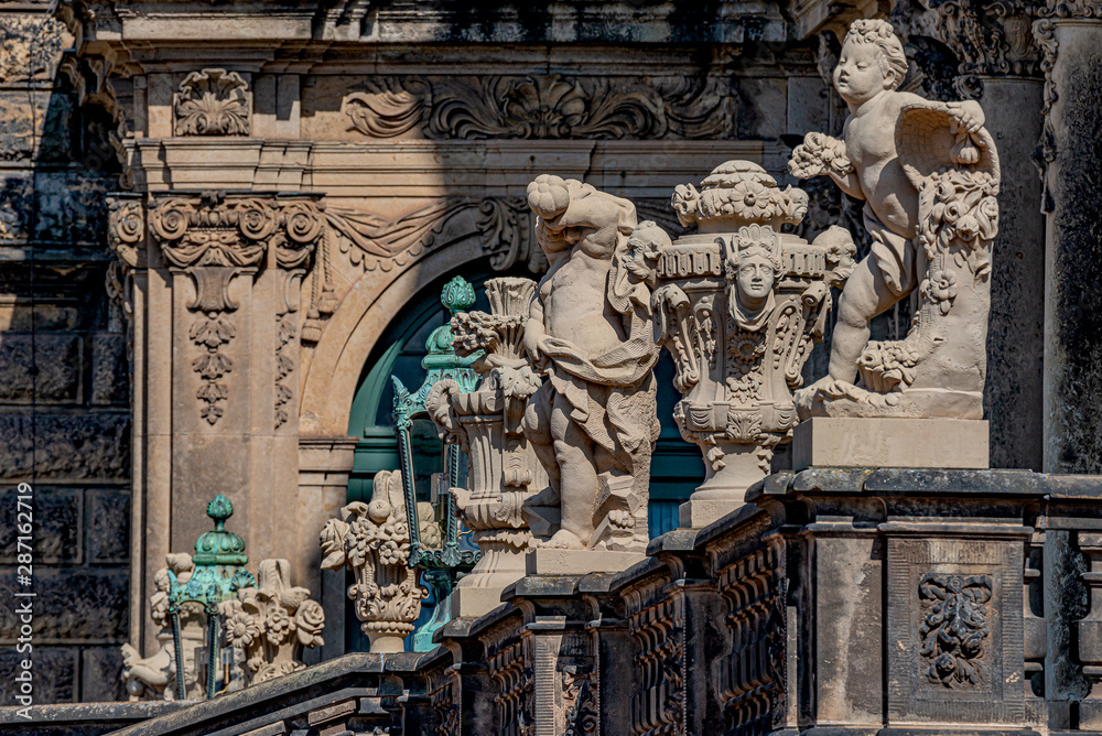 Row of old mythological and religious statues in the Zwinger palace and garden in downtown of Dresden, Germany