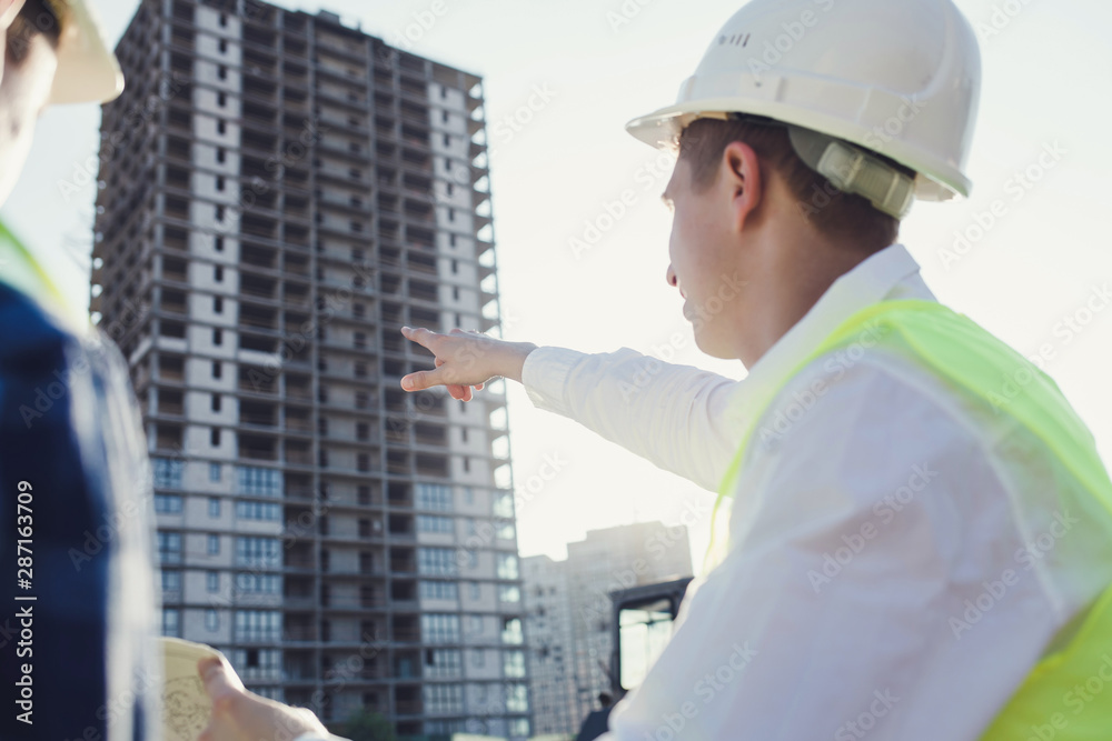Construction concept of engineer and architect working at construction site