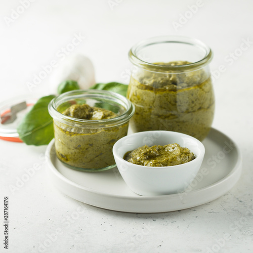 Homemade pesto sauce in jars