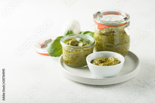 Homemade pesto sauce in jars