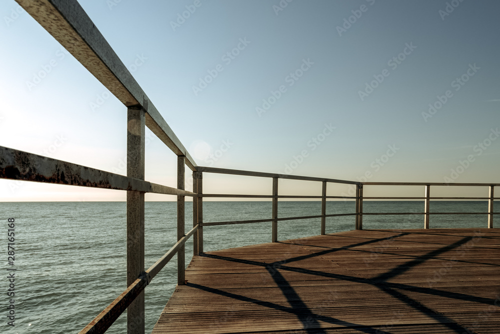 Footbridge over the sea made with wood