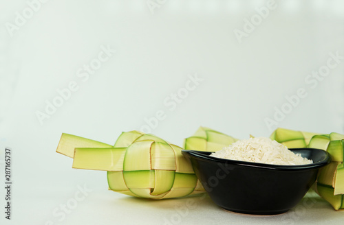 Ketupat or rice dumpling a famous main course during the festive season.Ketupat's, a rice casing made from young coconut leaves for cooking rice. photo