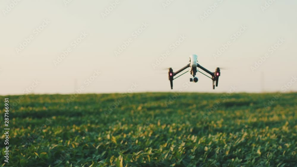 Close up smart agriculture drone flying in sky rural aerial helicopter agros copter farm farming field industry landscape meadow nature plant professional vehicle harvest innovation slow motion Close up smart agriculture drone flying in sky rural aerial helicopter agros copter farm farming field industry landscape meadow nature plant professional vehicle harvest innovation slow motion