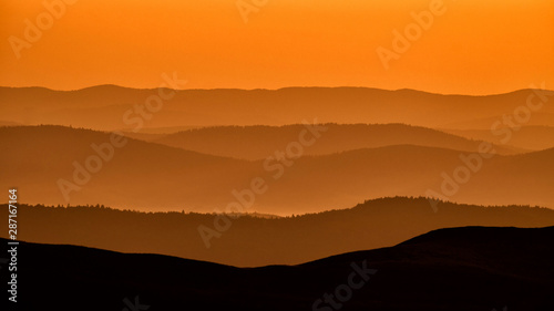 Fototapeta Naklejka Na Ścianę i Meble -  Silhouettes of the mountains at sunrise. Bieszczady National Park. Poland