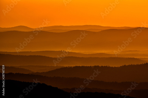 Silhouettes of the mountains at sunrise. Bieszczady National Park. Poland