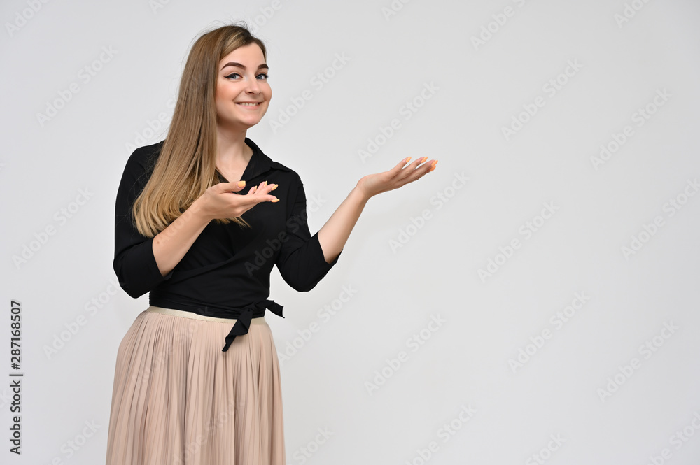 Portrait of a cute middle-aged manager brunette woman with beautiful curly hair and perfect face skin in a business suit on a white background. Beauty, brightness, smile. Portrait of a cute middle-aged manager brunette woman with beautiful curly hair and perfect face skin in a business suit on a white background. Beauty, brightness, smile.