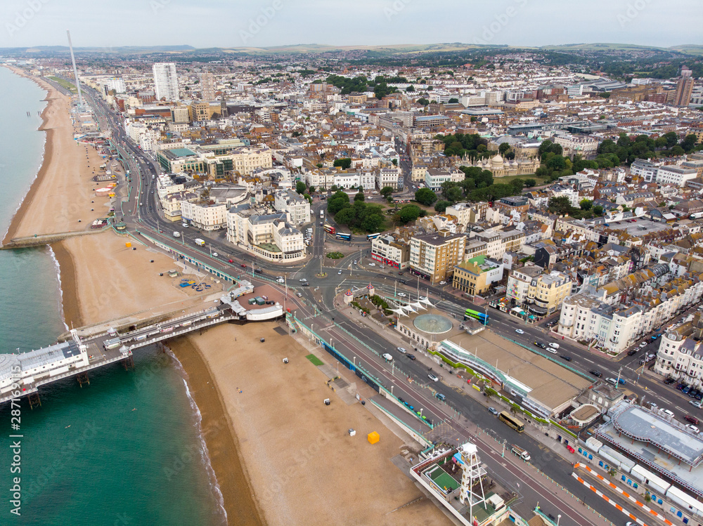 Obraz premium Aerial photo of the Brighton beach and coastal area located in the south coast of England UK that is part of the City of Brighton and Hove, taken on a bright sunny day