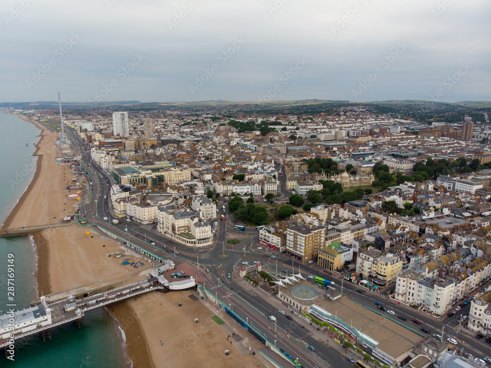 Aerial photo of the Brighton beach and coastal area located in the south coast of England UK that is part of the City of Brighton and Hove, taken on a bright sunny day