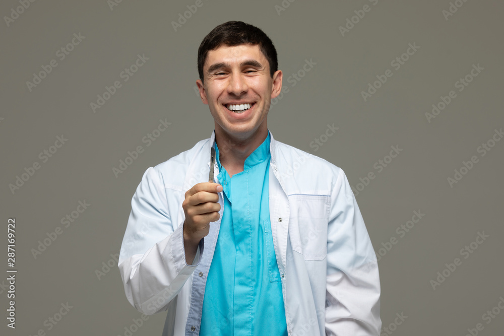doctor surgeon with a surgical knife in hand. doctor surgeon with a surgical knife in hand.