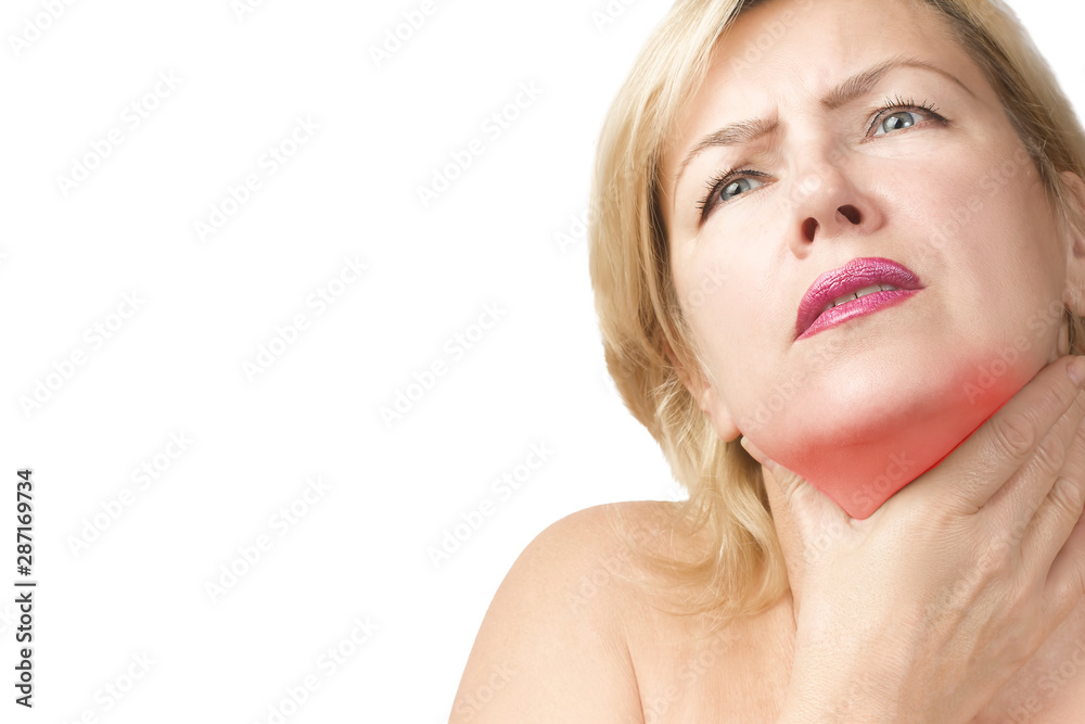 A sore throat in a middle-aged woman. A woman holds the hand in the area of the inflamed throat. Women's health concept A sore throat in a middle-aged woman. A woman holds the hand in the area of the inflamed throat. Women's health concept