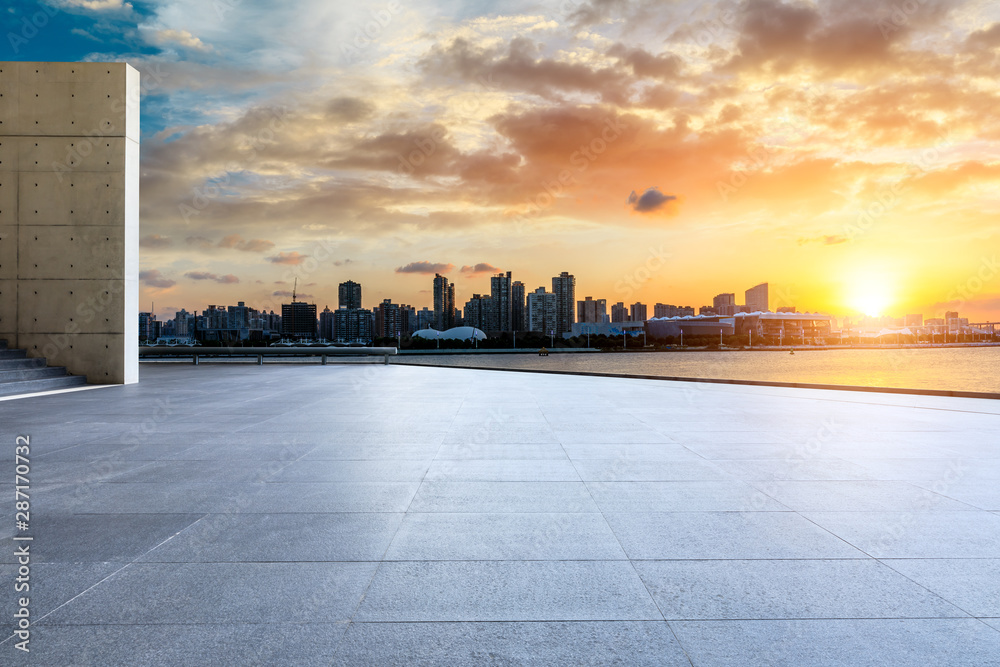 Empty square floor and city skyline at sunset in Shanghai