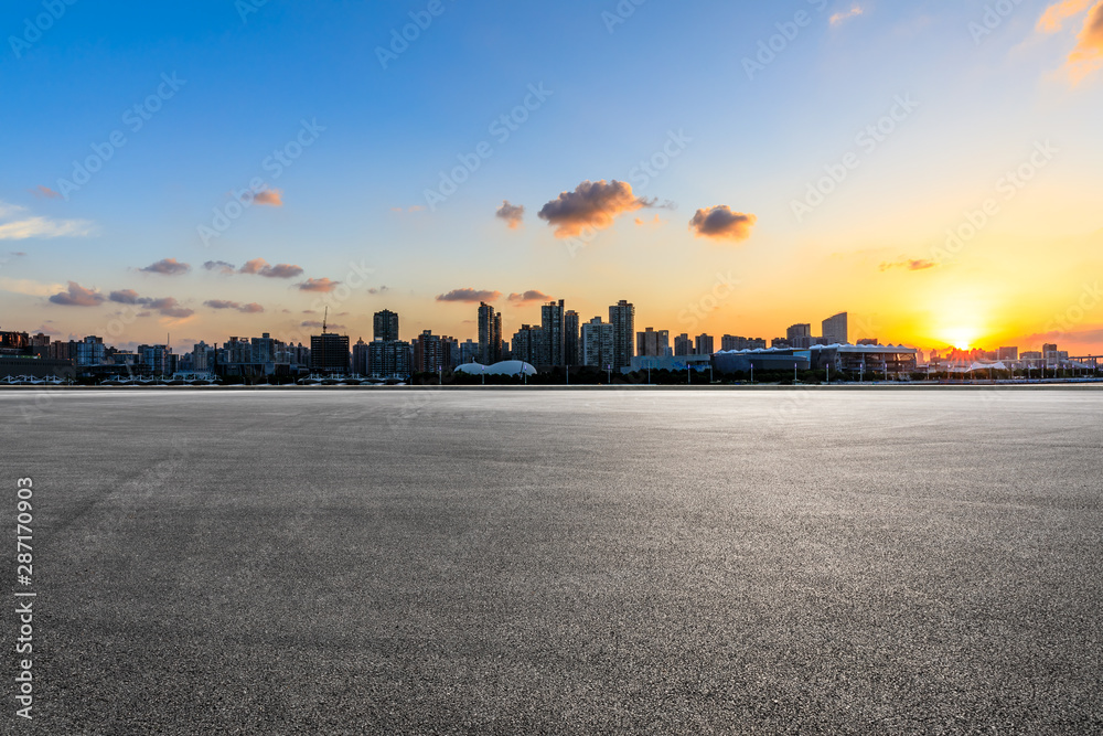 Asphalt race track and city skyline at sunset in Shanghai,China. Asphalt race track and city skyline at sunset in Shanghai,China.
