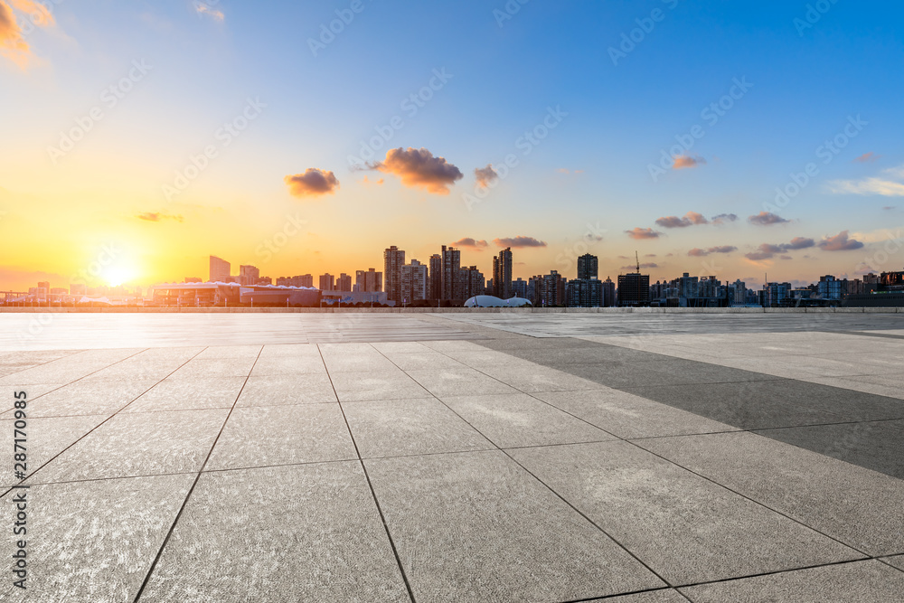 Empty square floor and city skyline at sunset in Shanghai Empty square floor and city skyline at sunset in Shanghai