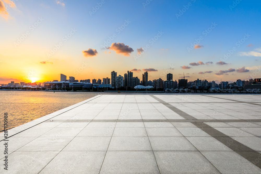 Empty square floor and city skyline at sunset in Shanghai