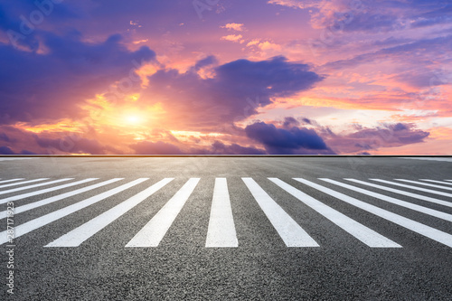 Crosswalk road and beautiful sky clouds at sunset