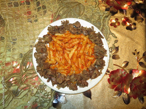 Fingers Pasta With Sauce And Chicken Liver Cooked With Onions photo