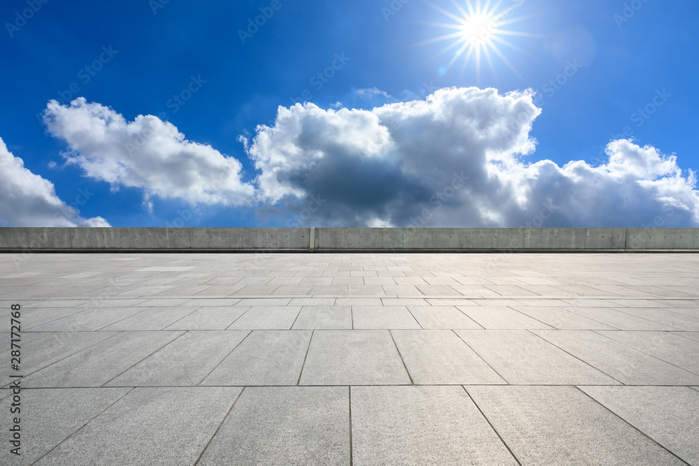 Wide square floor and blue sky with white clouds