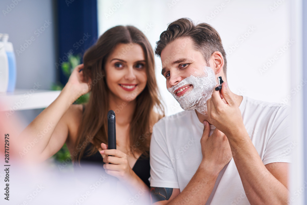 Portrait of happy young couple in the bathroom